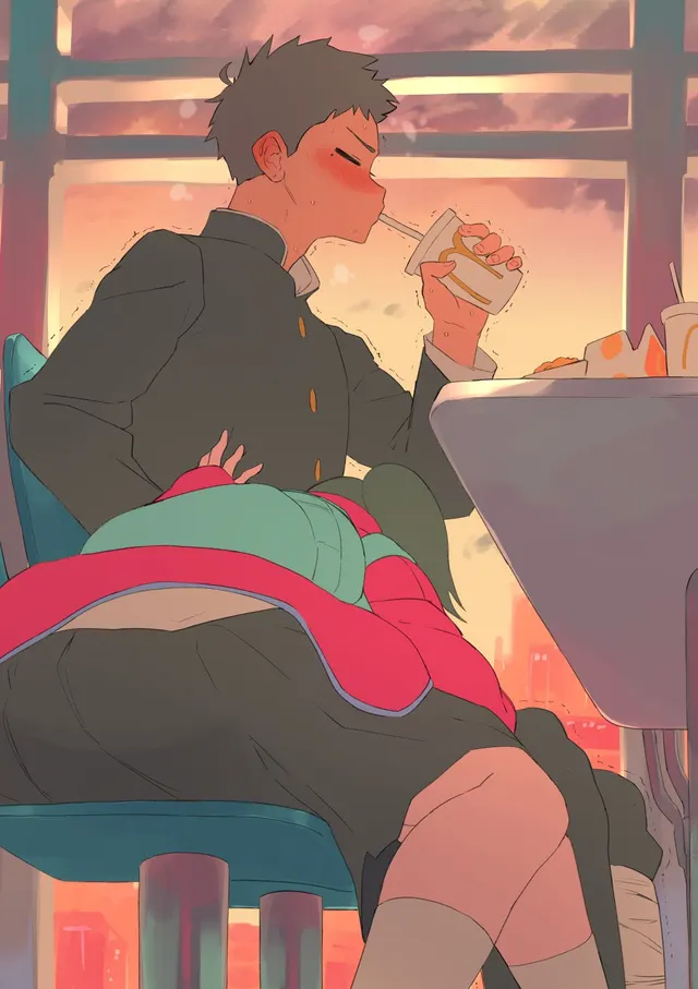 Getting those fries that fell on his lap.